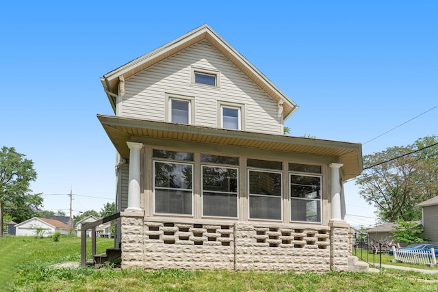 view of front of house featuring a sunroom