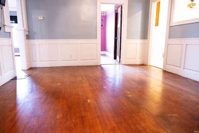 281 Dayton Rd, Dayton, IN 47941 - spare room with a decorative wall, wainscoting, wood finished floors, and ornate columns