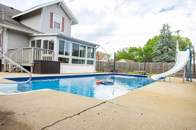 281 Dayton Rd, Dayton, IN 47941 - view of pool featuring a water slide, a sunroom, a patio, and a fenced backyard