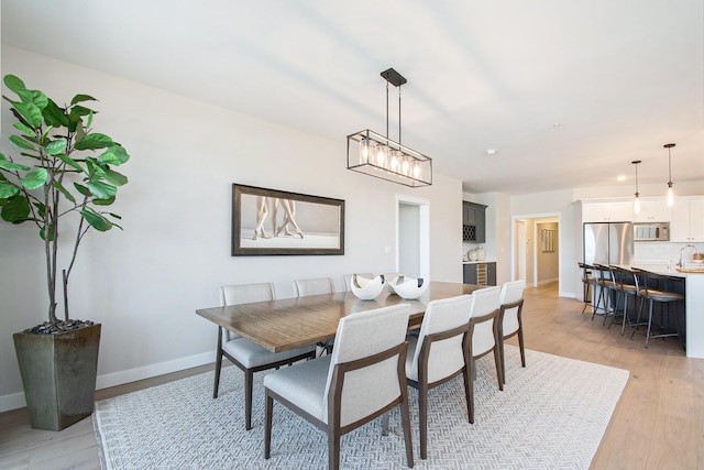 1740301W S Bend Ave, South Bend, IN 46637 - dining area featuring baseboards and light wood finished floors