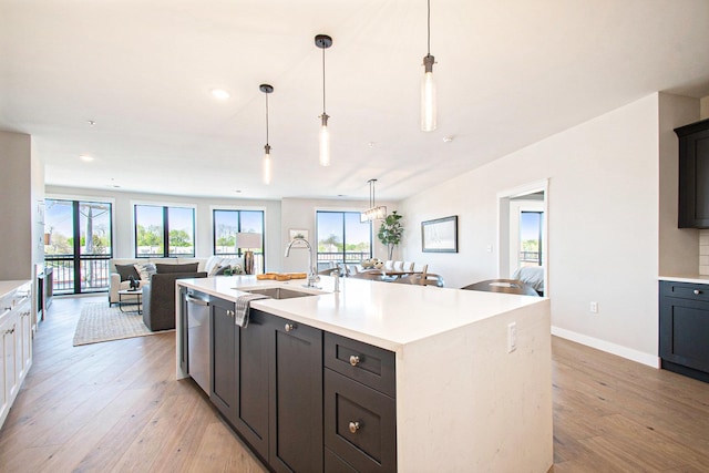 1740301W S Bend Ave, South Bend, IN 46637 - kitchen with open floor plan, a sink, appliances with stainless steel finishes, light countertops, and light wood-style floors
