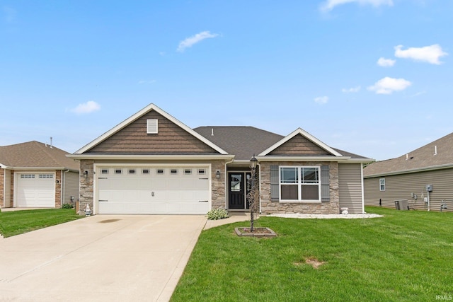 view of front facade featuring stone siding, a front yard, concrete driveway, a garage, and central air condition unit