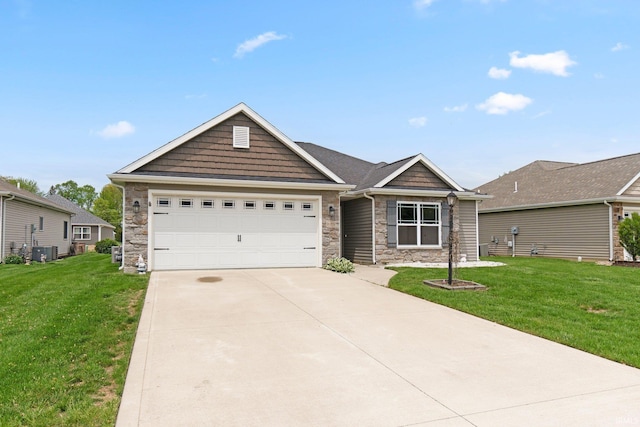 view of front of property with stone siding, driveway, a garage, and a front yard