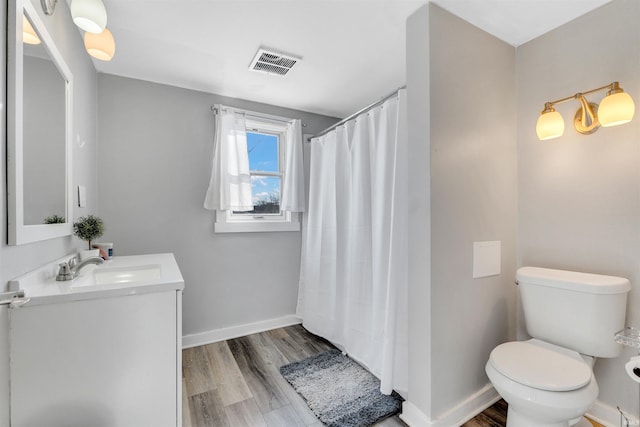 1820 Saint Marys Ave, Fort Wayne, IN 46808 - bathroom featuring toilet, baseboards, vanity, wood finished floors, and curtained shower