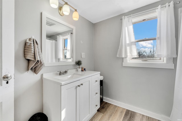 1820 Saint Marys Ave, Fort Wayne, IN 46808 - full bath featuring wood finished floors, vanity, and baseboards