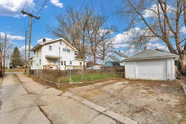 1820 Saint Marys Ave, Fort Wayne, IN 46808 - view of home's exterior featuring dirt driveway, a chimney, a garage, an outbuilding, and a residential view