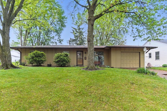 1320 Curdes Ave, Fort Wayne, IN 46805 - ranch-style home with board and batten siding, a garage, a front yard, and driveway