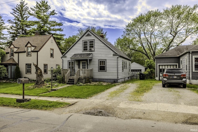 2103 S Hackley St, Muncie, IN 47302 - view of front facade with driveway and a front lawn