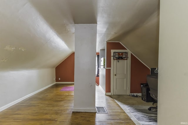 2103 S Hackley St, Muncie, IN 47302 - additional living space featuring wood finished floors, baseboards, and vaulted ceiling
