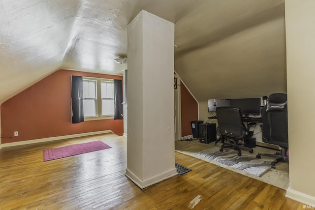 2103 S Hackley St, Muncie, IN 47302 - home office featuring vaulted ceiling, baseboards, and hardwood / wood-style flooring