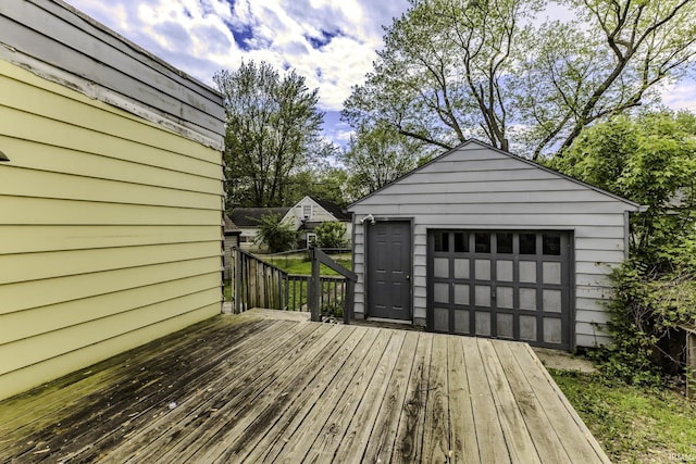 2103 S Hackley St, Muncie, IN 47302 - wooden deck with a detached garage and an outdoor structure