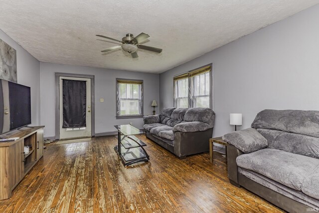 2103 S Hackley St, Muncie, IN 47302 - living room with dark wood-type flooring, ceiling fan, and a textured ceiling