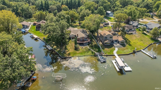 aerial perspective of suburban area with a nearby body of water