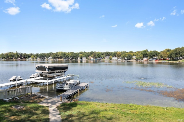 dock area with a water view and boat lift