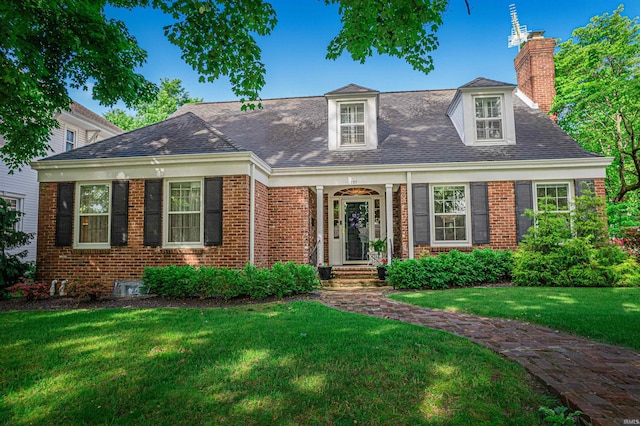 727 Mulberry St, Mount Vernon, IN 47620 - cape cod-style house with a chimney, a front lawn, brick siding, and roof with shingles
