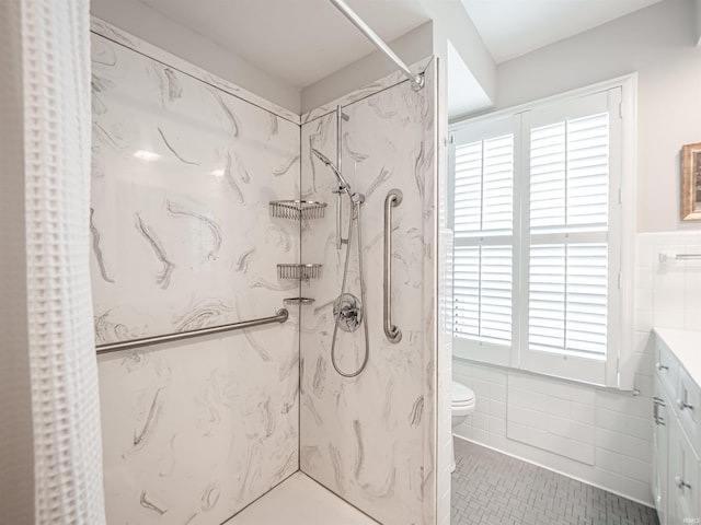 727 Mulberry St, Mount Vernon, IN 47620 - full bathroom with tile walls, a marble finish shower, healthy amount of natural light, tile patterned floors, and a wainscoted wall