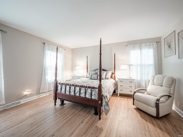 727 Mulberry St, Mount Vernon, IN 47620 - bedroom featuring light wood-type flooring, multiple windows, and baseboards