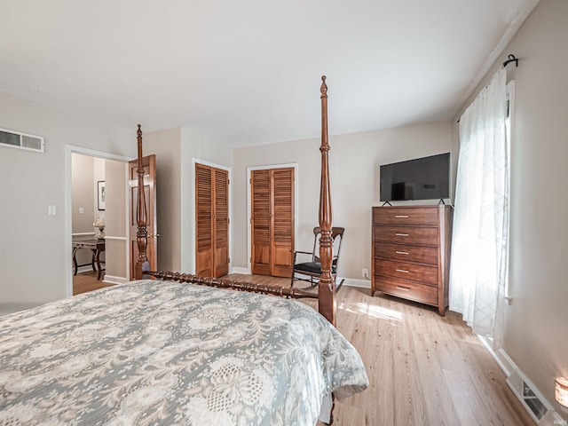 727 Mulberry St, Mount Vernon, IN 47620 - bedroom featuring wood finished floors, baseboards, and two closets