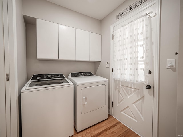 727 Mulberry St, Mount Vernon, IN 47620 - laundry area featuring washer and clothes dryer, cabinet space, and light wood-style floors