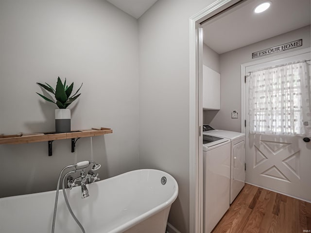 727 Mulberry St, Mount Vernon, IN 47620 - laundry room featuring cabinet space, washing machine and dryer, and light wood-style floors