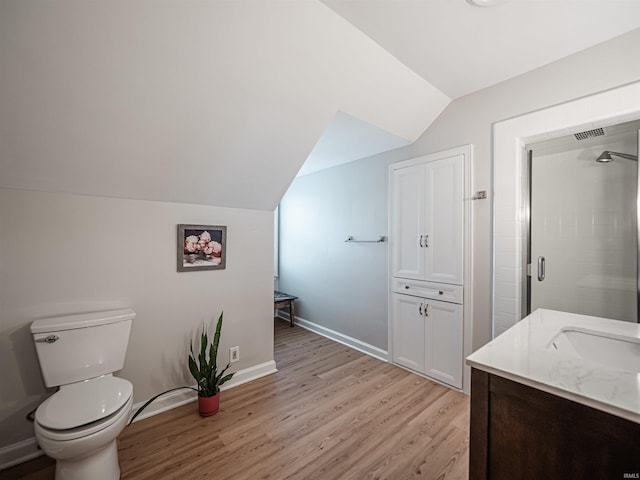 727 Mulberry St, Mount Vernon, IN 47620 - full bath featuring vaulted ceiling, wood finished floors, toilet, a stall shower, and baseboards