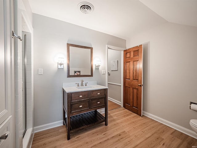 727 Mulberry St, Mount Vernon, IN 47620 - full bath featuring wood finished floors, toilet, baseboards, vanity, and a shower