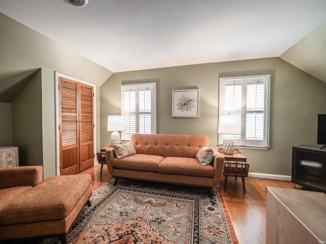 727 Mulberry St, Mount Vernon, IN 47620 - living room featuring vaulted ceiling, wood finished floors, plenty of natural light, and baseboards