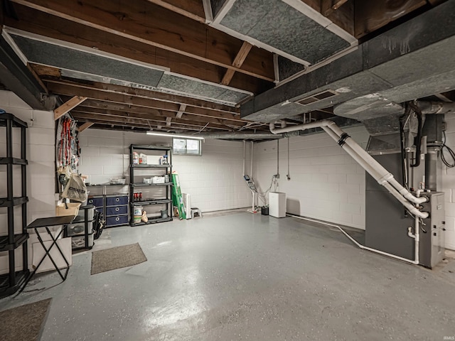 727 Mulberry St, Mount Vernon, IN 47620 - below grade area featuring concrete block wall and heating unit