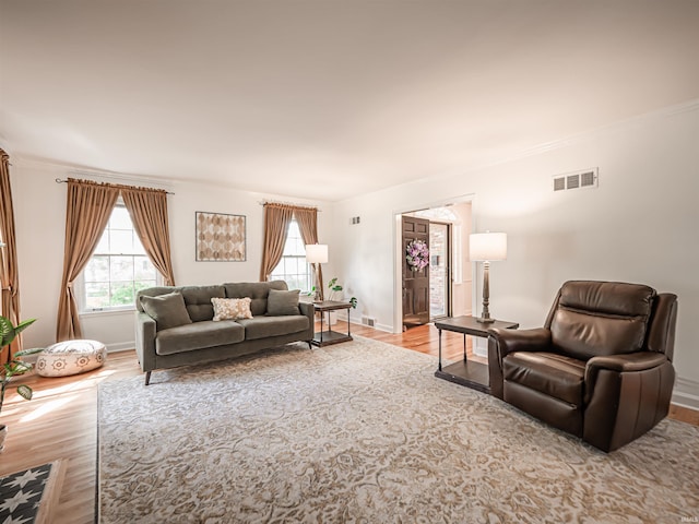 727 Mulberry St, Mount Vernon, IN 47620 - living room with wood finished floors, ornamental molding, and baseboards