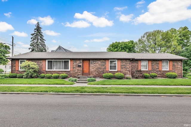 1723 Central St, Lafayette, IN 47905 - single story home with brick siding, a front yard, and a shingled roof