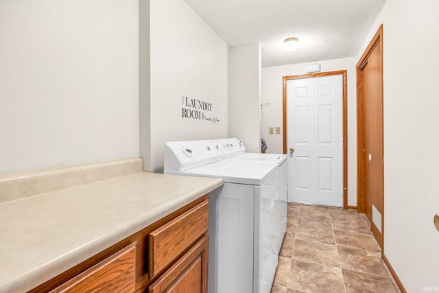 1723 Central St, Lafayette, IN 47905 - clothes washing area featuring baseboards, washer and clothes dryer, cabinet space, stone finish flooring, and a textured ceiling