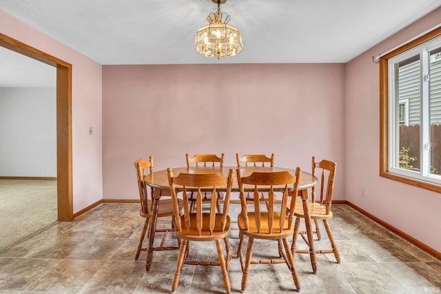 1723 Central St, Lafayette, IN 47905 - dining space featuring a chandelier and baseboards