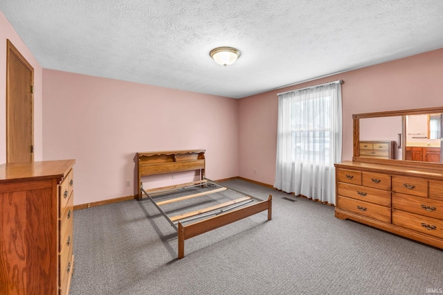 1723 Central St, Lafayette, IN 47905 - bedroom with carpet, baseboards, and a textured ceiling