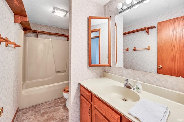 1723 Central St, Lafayette, IN 47905 - full bath with toilet, wallpapered walls, vanity, and bathtub / shower combination