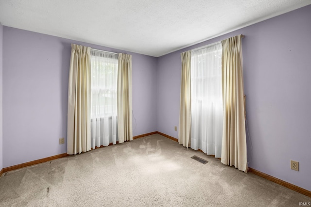 1723 Central St, Lafayette, IN 47905 - empty room featuring light carpet and baseboards