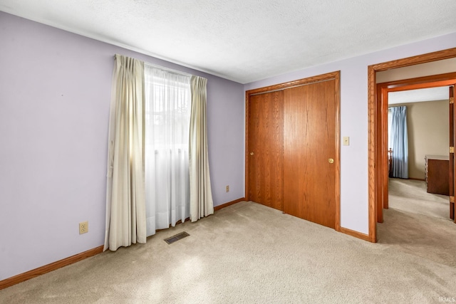 1723 Central St, Lafayette, IN 47905 - unfurnished bedroom featuring carpet floors, a closet, and baseboards