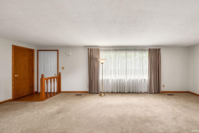 1723 Central St, Lafayette, IN 47905 - carpeted spare room featuring baseboards and a textured ceiling