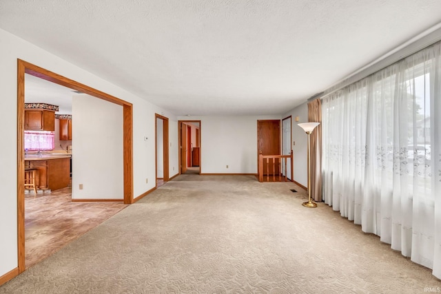 1723 Central St, Lafayette, IN 47905 - spare room featuring light carpet and baseboards