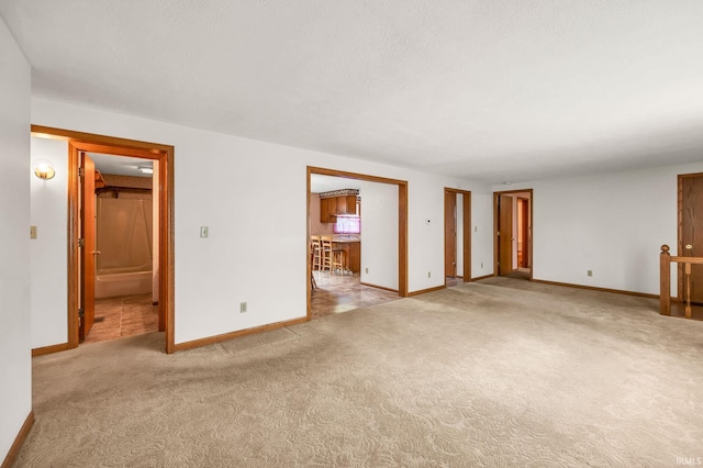 1723 Central St, Lafayette, IN 47905 - unfurnished living room with baseboards and carpet