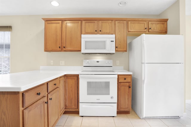 5849 Porterfield Dr, Evansville, IN 47711 - kitchen with white appliances, light countertops, recessed lighting, a peninsula, and brown cabinetry