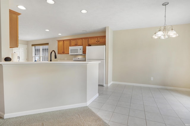 5849 Porterfield Dr, Evansville, IN 47711 - kitchen with white appliances, a sink, baseboards, a chandelier, and light countertops