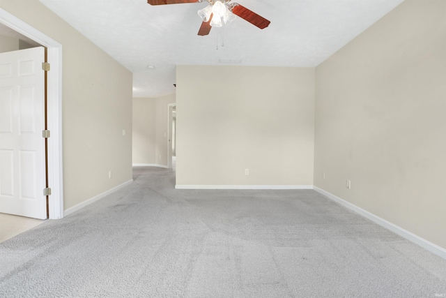 5849 Porterfield Dr, Evansville, IN 47711 - spare room featuring light carpet, a ceiling fan, and baseboards