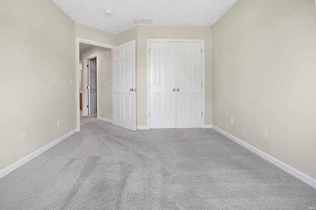 5849 Porterfield Dr, Evansville, IN 47711 - unfurnished bedroom featuring carpet floors, baseboards, and a closet