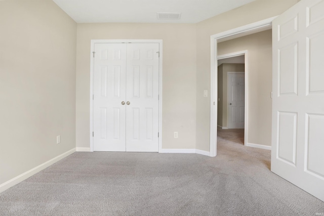 5849 Porterfield Dr, Evansville, IN 47711 - unfurnished bedroom with carpet floors, a closet, and baseboards