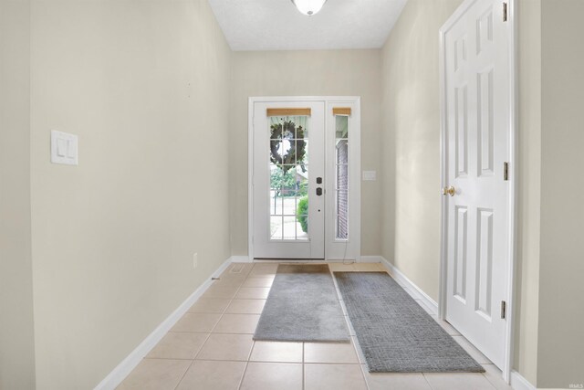 5849 Porterfield Dr, Evansville, IN 47711 - entryway with light tile patterned floors and baseboards