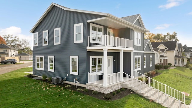732 S Bend Ave, South Bend, IN 46617 - back of house featuring a balcony, a lawn, and central AC