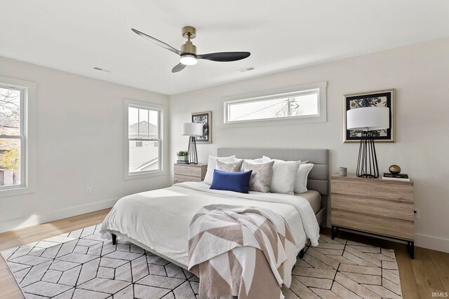 732 S Bend Ave, South Bend, IN 46617 - bedroom with light wood-type flooring, baseboards, and ceiling fan