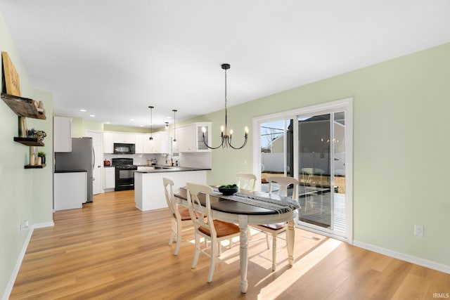 1507 Tara Bella Ln, Fort Wayne, IN 46845 - dining area with light wood-style floors, a chandelier, recessed lighting, and baseboards