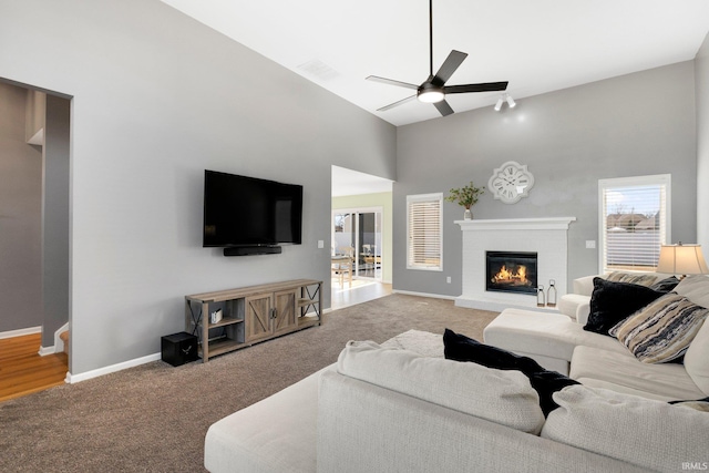 1507 Tara Bella Ln, Fort Wayne, IN 46845 - living area featuring carpet, high vaulted ceiling, ceiling fan, a fireplace, and baseboards
