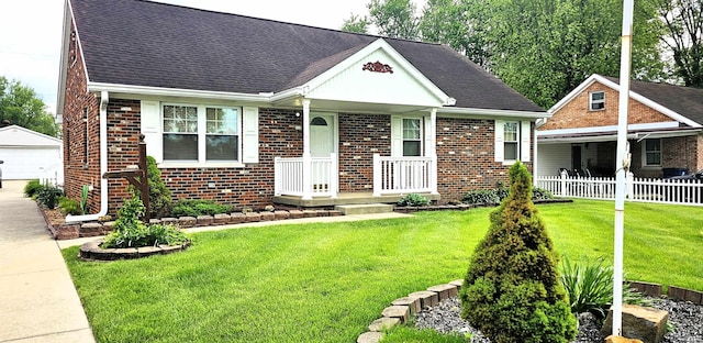 318 W Jefferson St, Chandler, IN 47610 - view of front facade featuring an outbuilding, a porch, brick siding, a detached garage, and roof with shingles